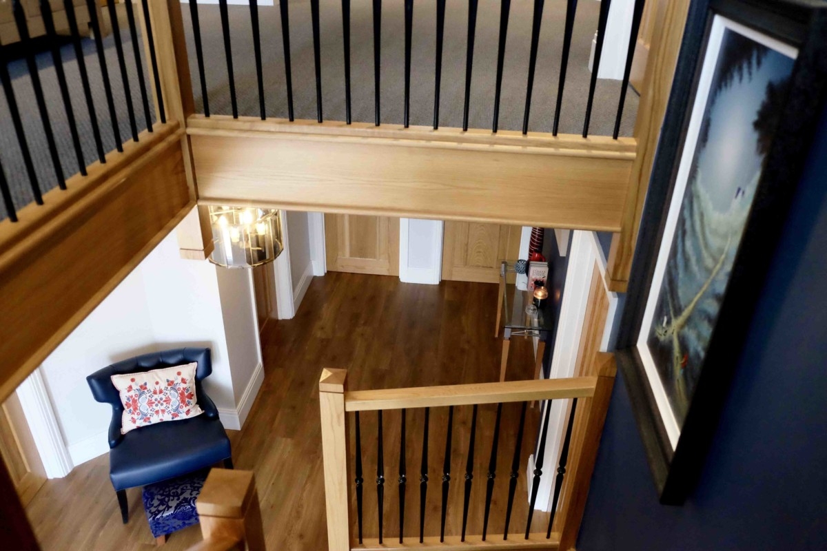 Wooden staircase and ahll way floor