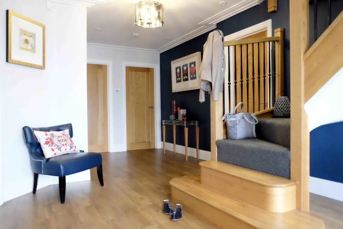 Hallway design, stiffkey blue and red accessories, oak staircase and traditional oak anticompetitive flooring