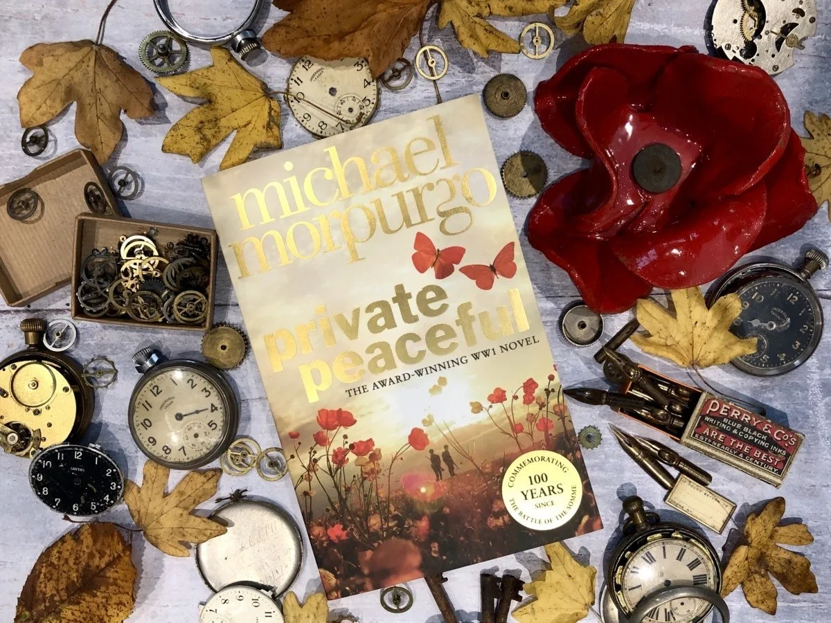 Michael Morpurgo Private Peaceful Unsung Heroes Book Tour flat lay of the book and poppies
