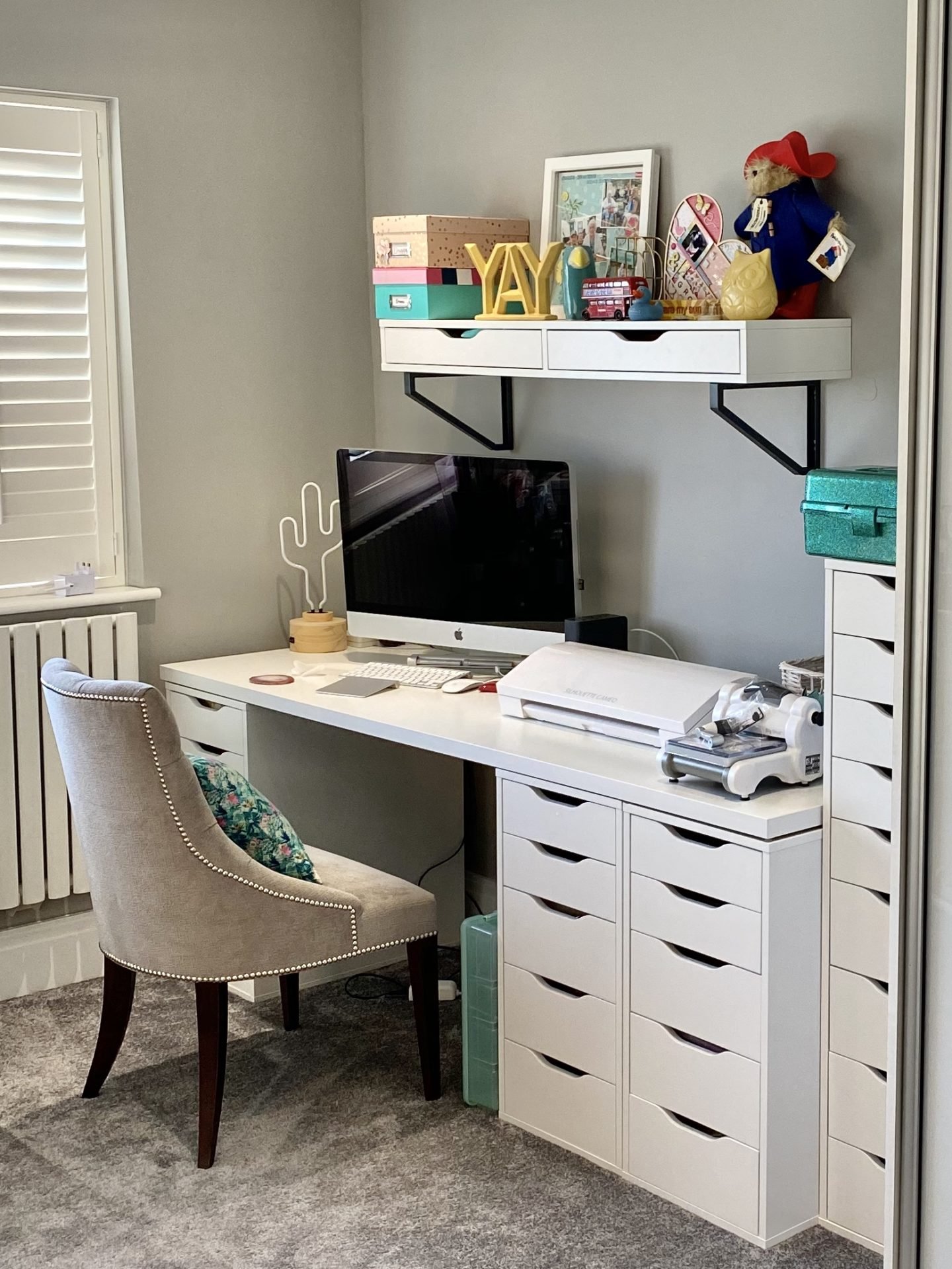 A dedicated scrapbooking desk with Silhouette and Bigshot on the desk. Scrapbooking craft room how to scrapbook for beginners