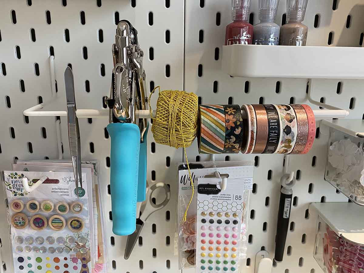 Ikea Skadis Roll holder on Craft Room Ikea Pegboard with washing tape 
