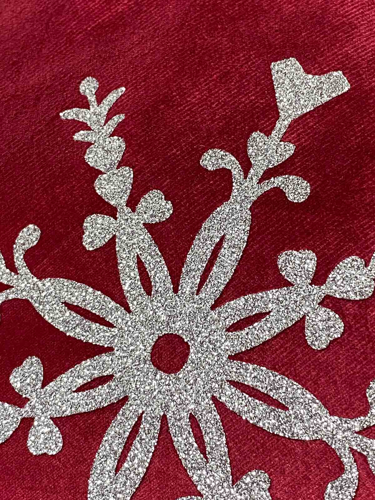 Free Heart Snowflake PNG on red velvet cushions with silver glitter vinyl snowflake. Free heart snowflake cut file used.