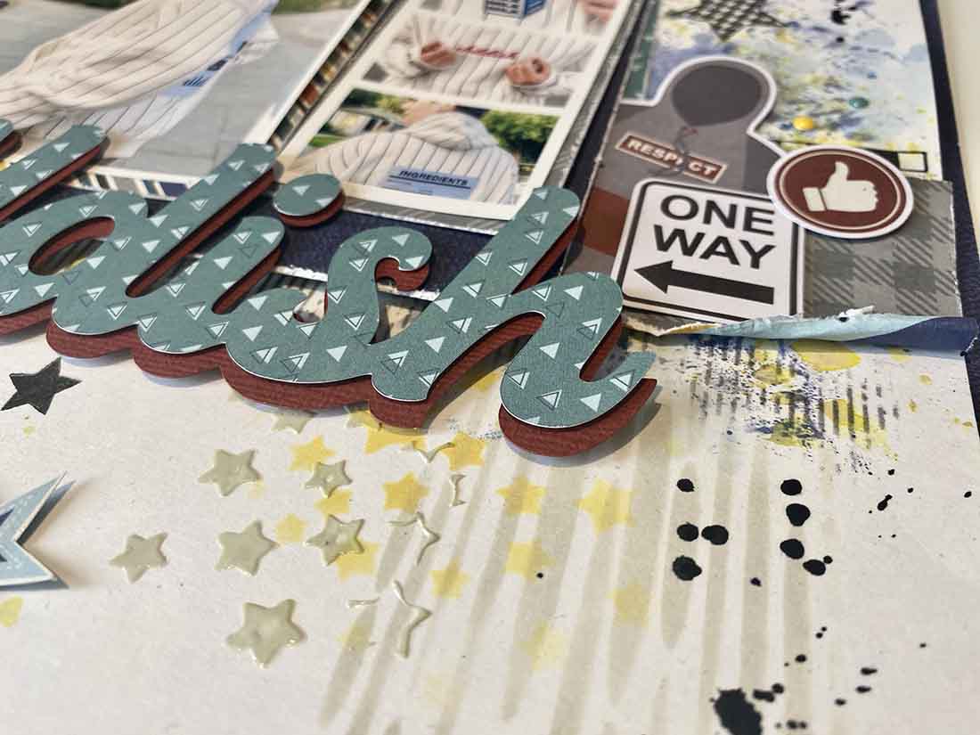 Use stencils with a variety of mediums to create added dimension on your mixed media scrapbook page 