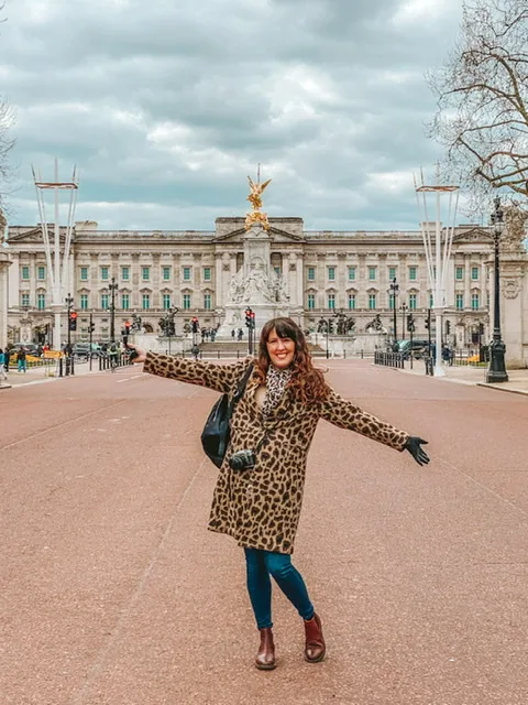 Buckingham palace London Woman standing in front