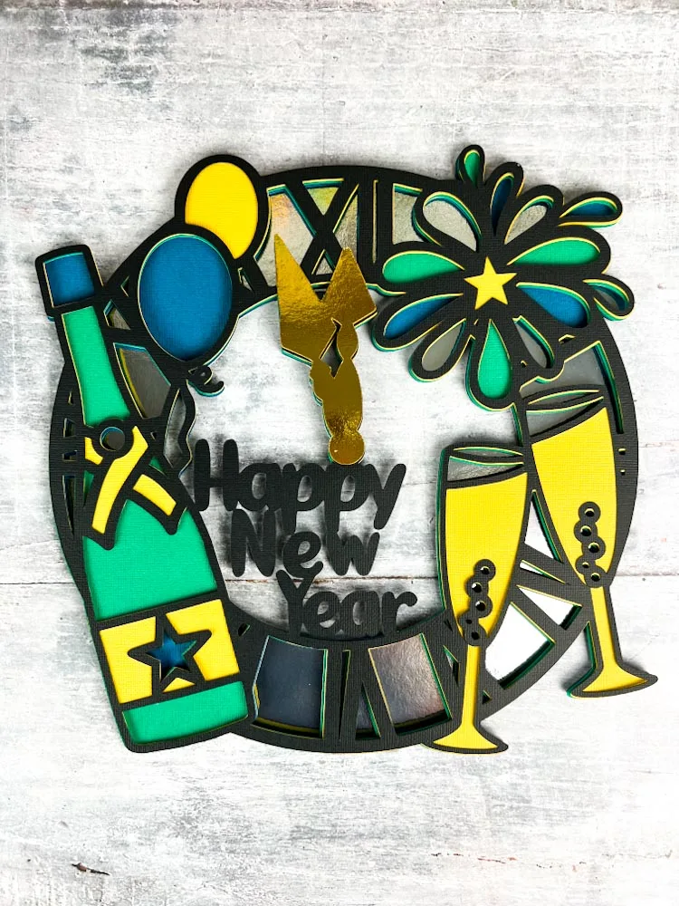 Free Happy New Year Wreath SVG cut file. Free Happy New year svg in a wreath style that can be cut with card on a cutting machine