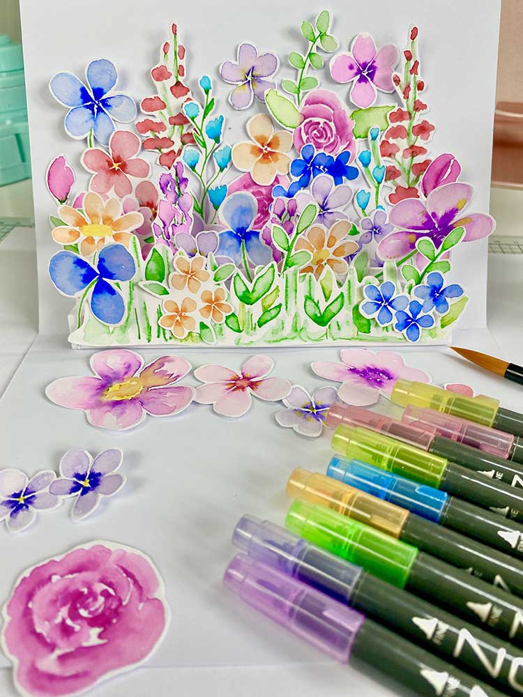 watercolour brush pen flowers on a pop up card tutorial on hoe to paint flowers with brush pens