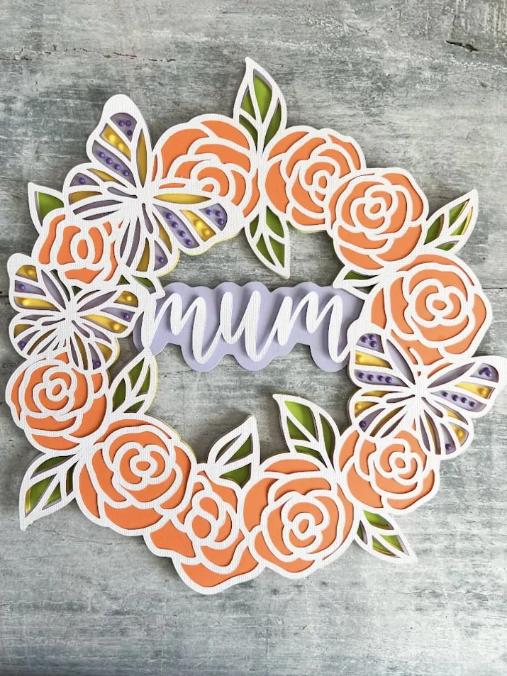 Orange rose and lilac butterfly’s in a cardstock svg layered Mother’s Day cut file