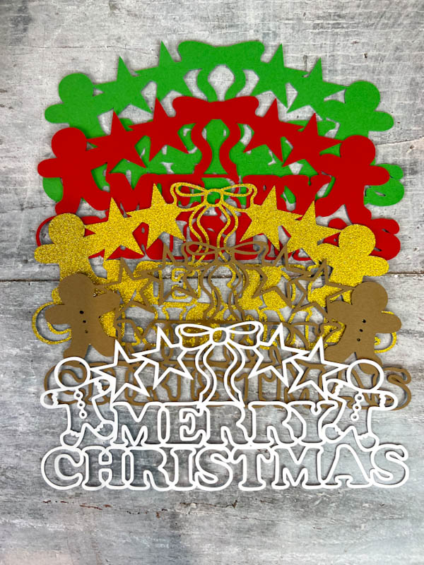 5 layers of Free Layered Merry Christmas SVG cut in card