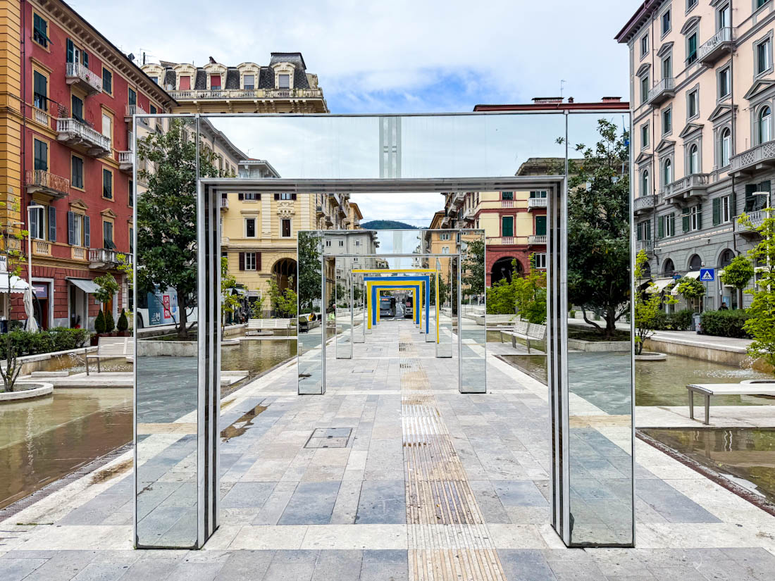 La Spezia, Italy alley with modern mirror arches with reflection by Daniel Buren