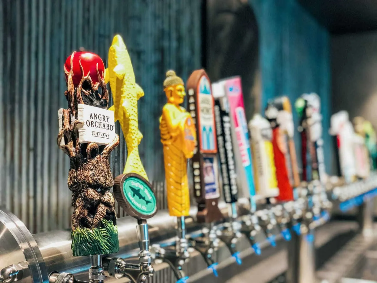 beer taps on the Crafts beers in the District bar on NCL Encore