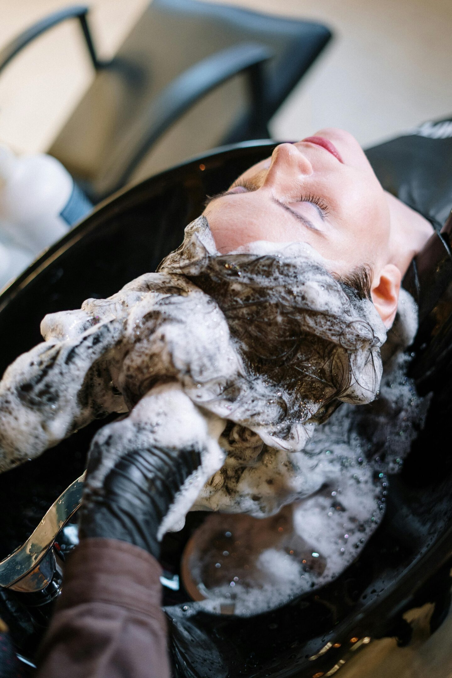 Shampooing hair in a back basin