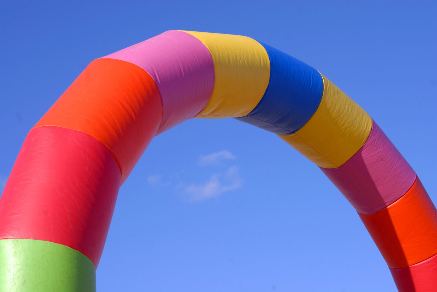 Colourful inflatable arch with sun and sky