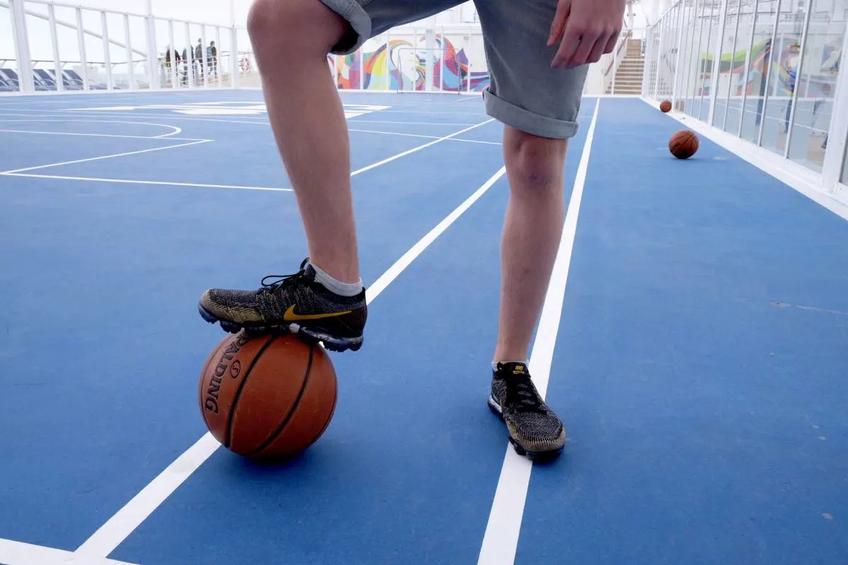 Symphony of the Seas sports court boy with ball